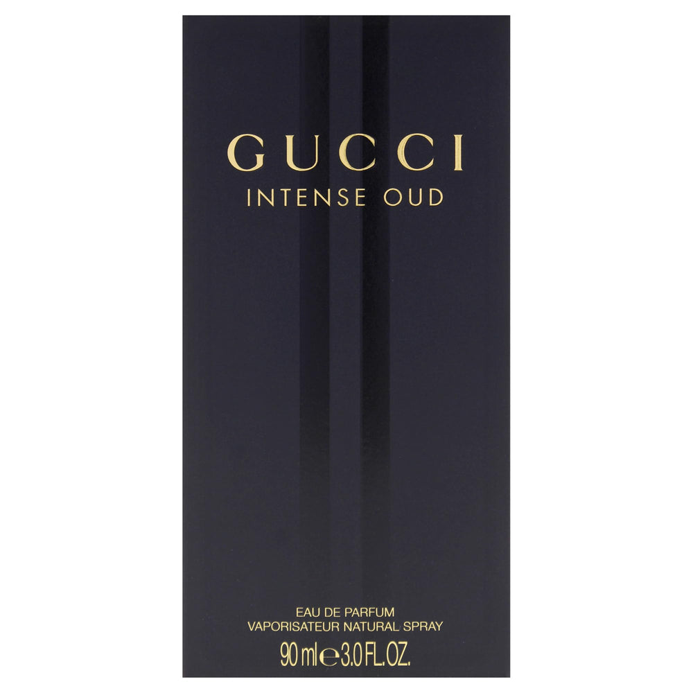 Gucci Intense Oud bottle against wood tones enhances mood for autumn evenings