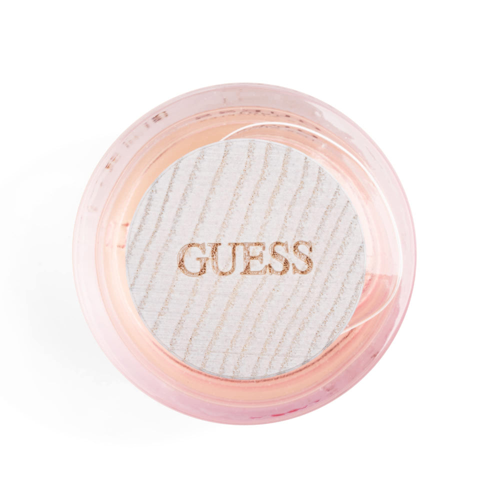 GUESS 1981 Los Angeles bottle under light shows liquid glow and shine.