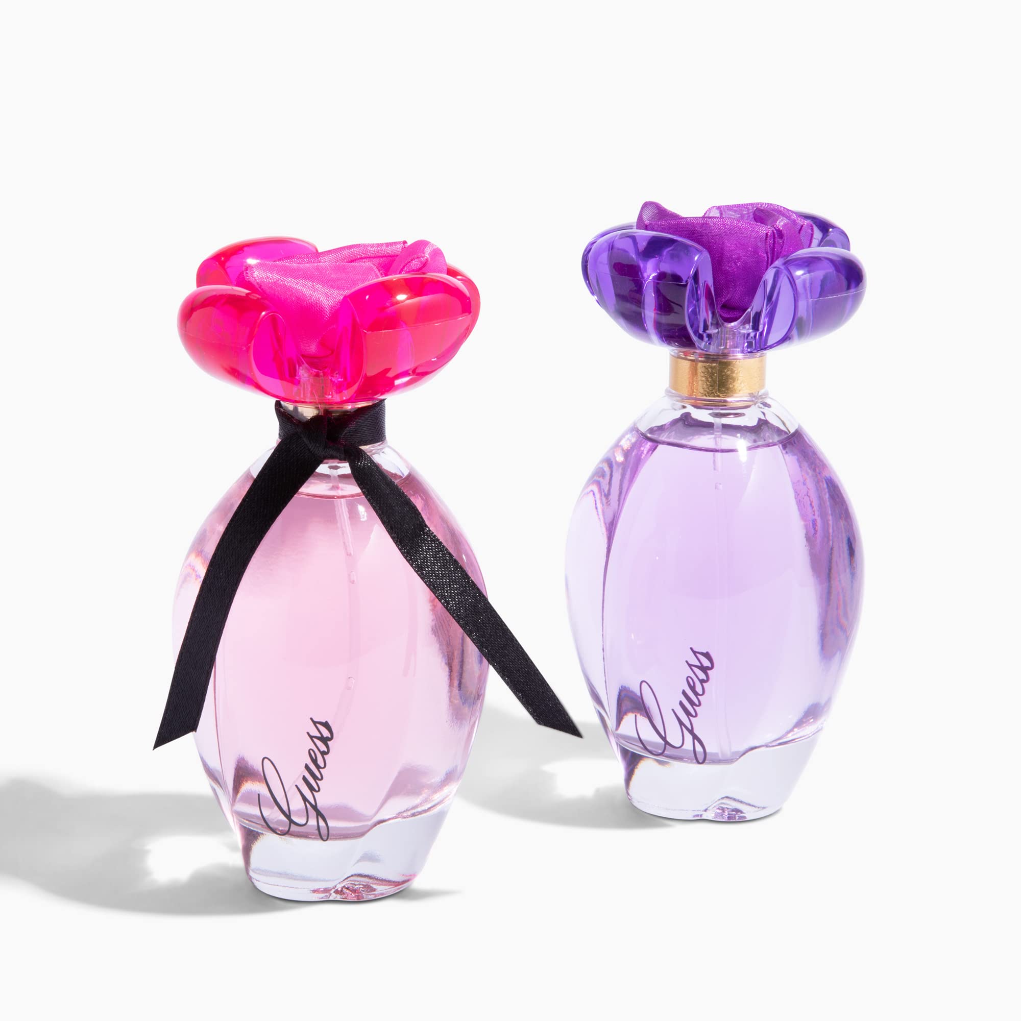 GUESS Girl liquid amber hue suggests rich warmth and lasting impression.