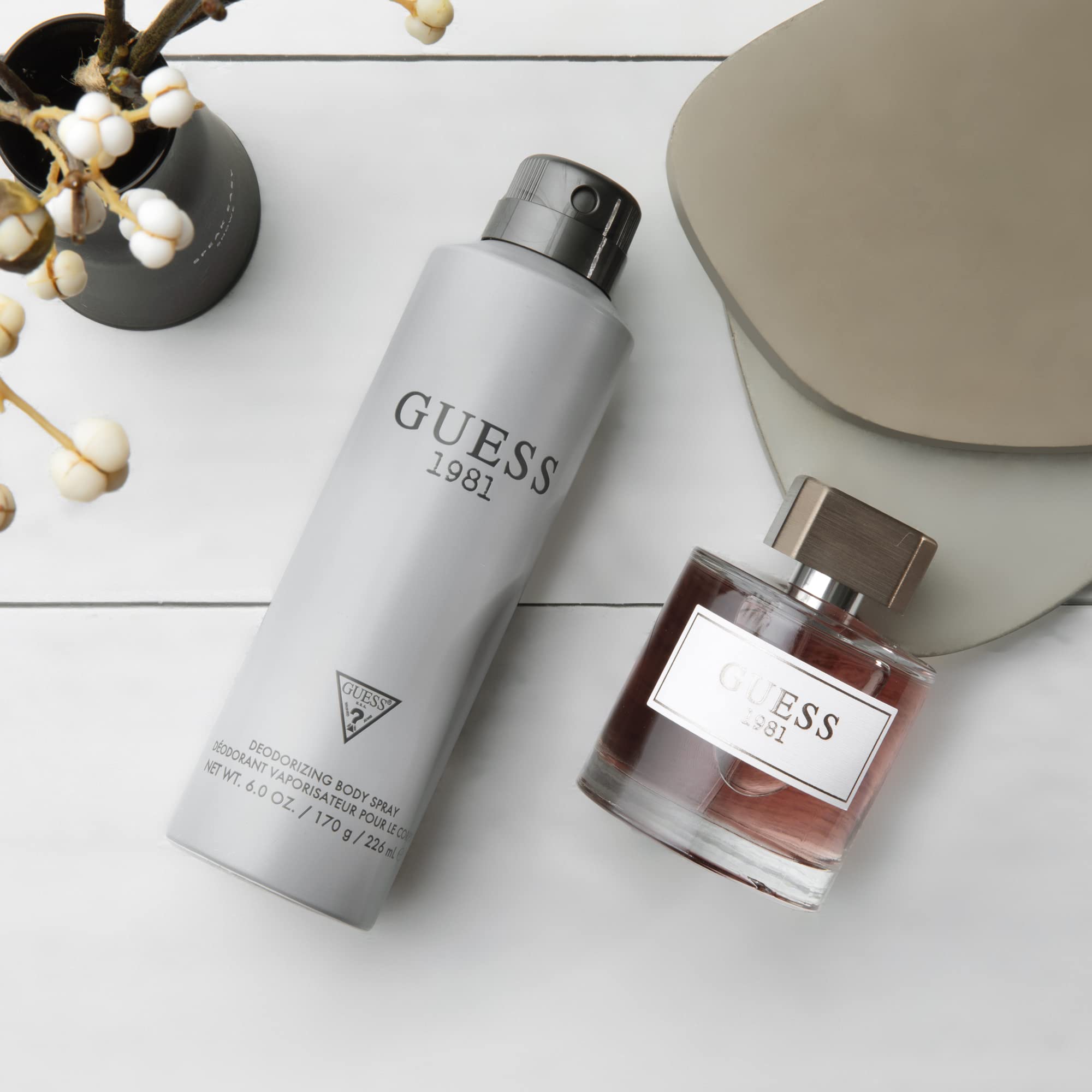 GUESS 1981 woodsy cedarwood and grey amber notes enhance evening allure.