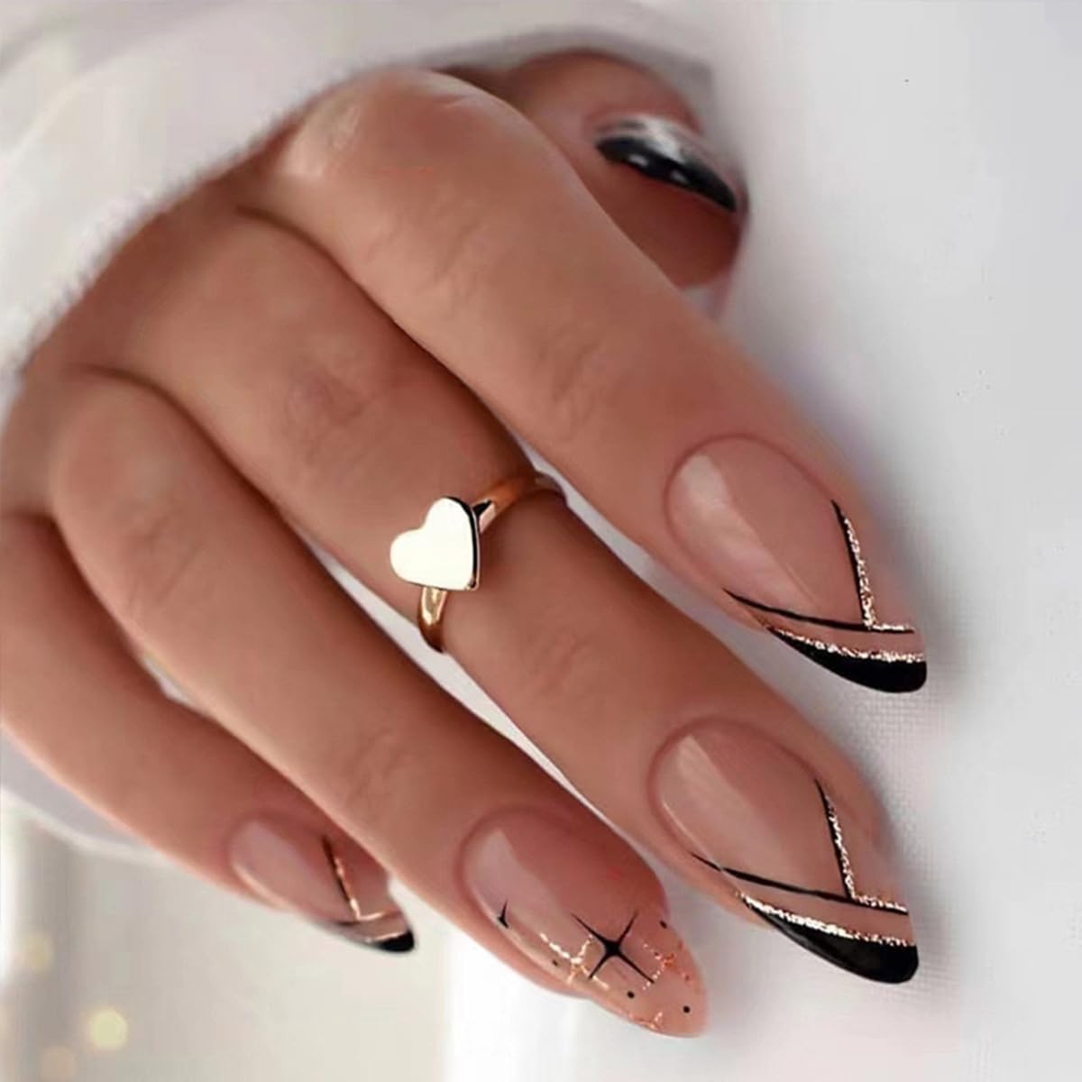 GUFUGU nails worn on fingers showcasing almond shape and shine.