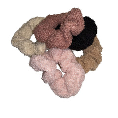 Guiyal teddy scrunchie chocolate cozy sherpa holds hair during activity.