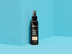 Hair Illusion Fiber Hold Spray being applied for secure fiber placement