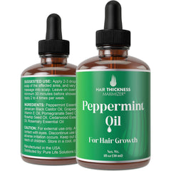 Hair Thickness Maximizer Peppermint Oil bottle 1oz on a clean surface for hair growth support.