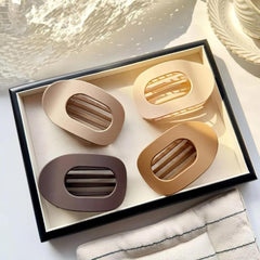 Hair clips for women 4-pack held in hand for portability.
