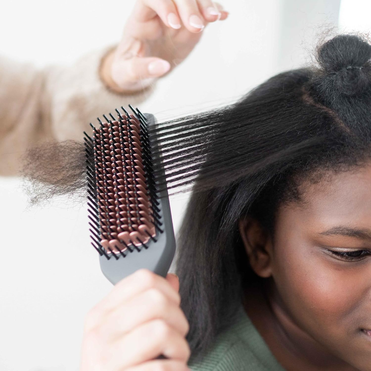 Hairitage frizz reduction ions image highlighting negative ion technology for calmer hair.