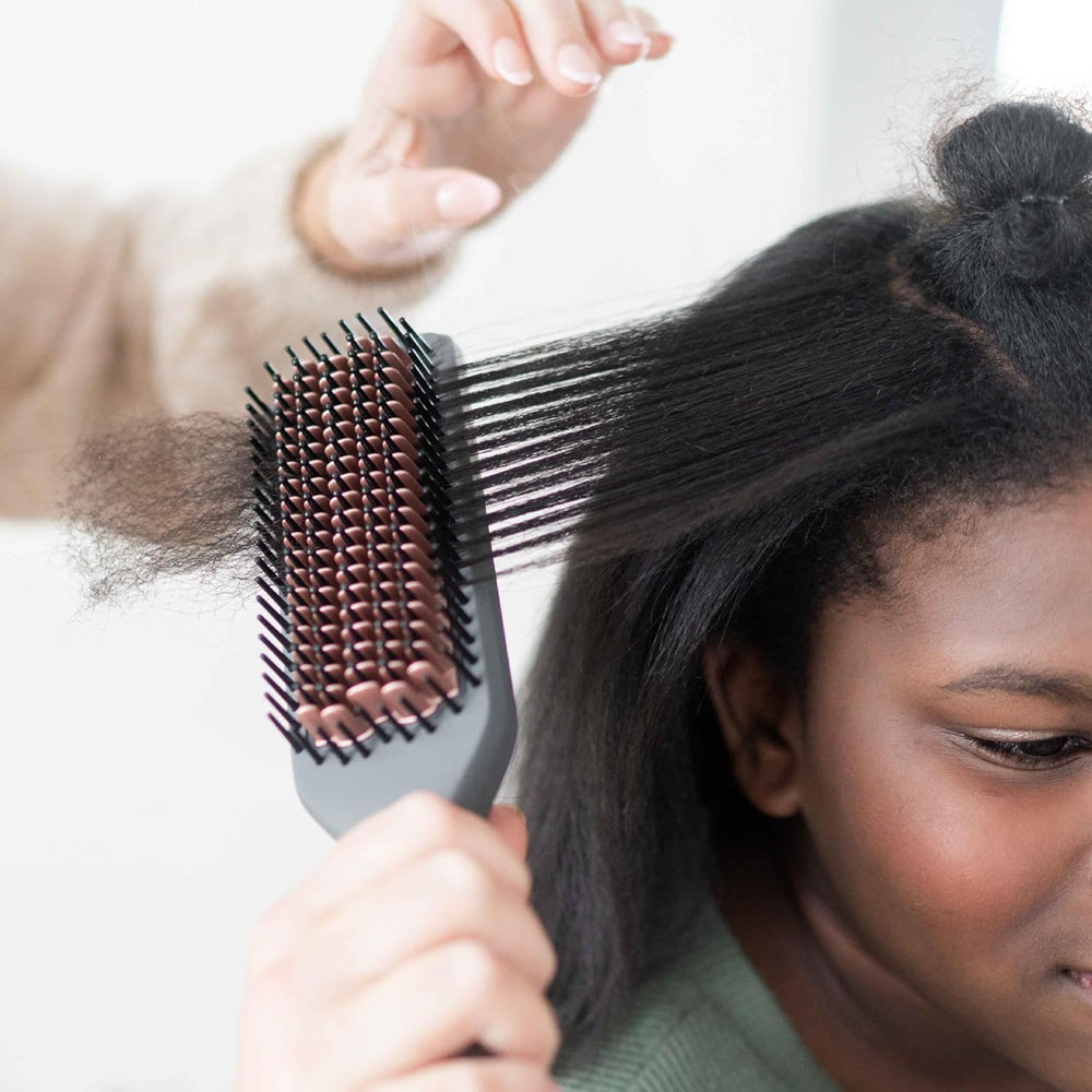 Hairitage frizz reduction ions image highlighting negative ion technology for calmer hair.