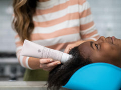 Hairitage Restart Button scrubbing-applicator demonstrates effective scalp cleansing action.