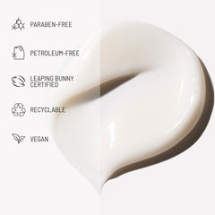 Hairstory Hair Balm application hand spreading product on damp hair.