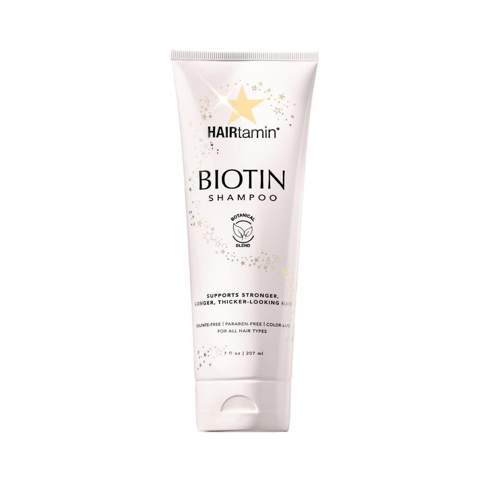 HAIRtamin Biotin Shampoo bottle lifestyle shot highlights volumized, fuller-looking hair.
