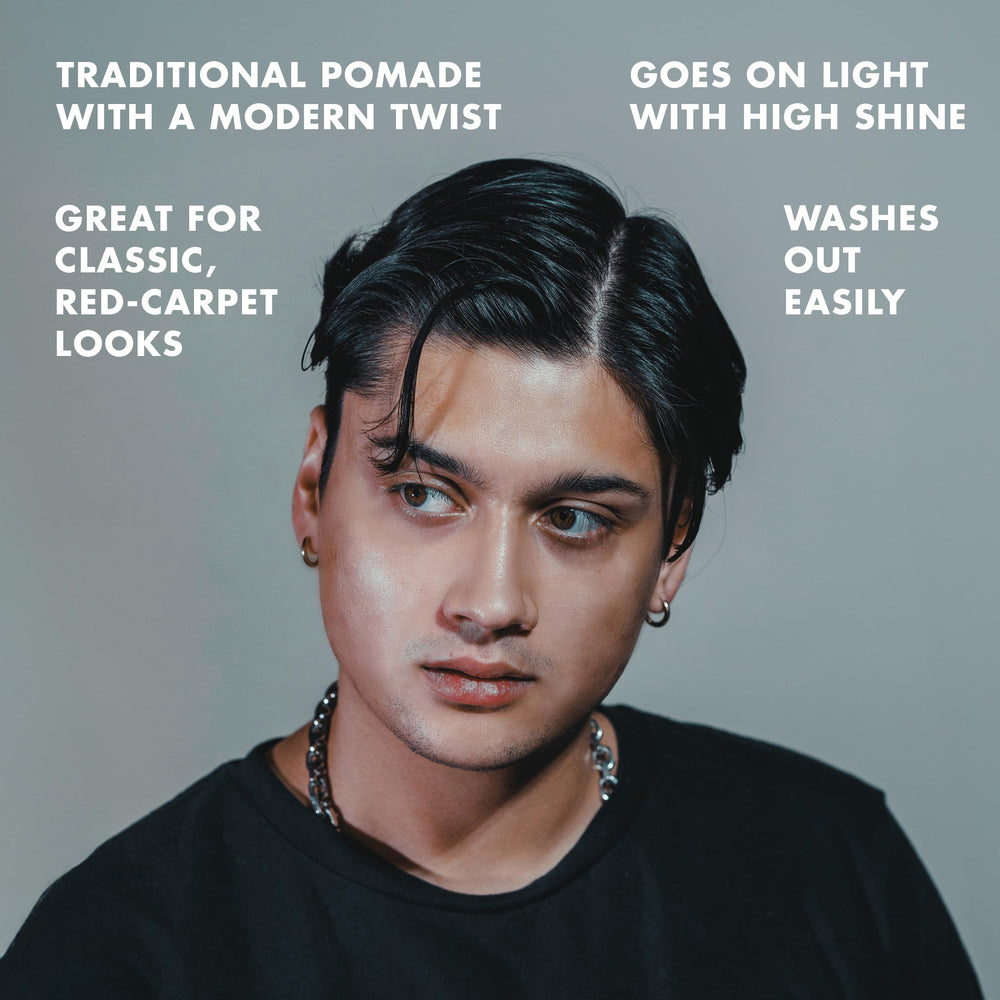 Hanz de Fuko Modify hands applying pomade for textured styling.