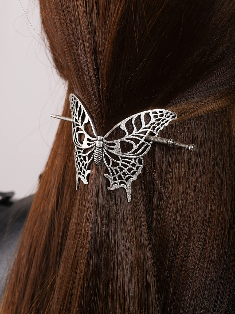 HAQUIL butterfly motif accenting a chic updo