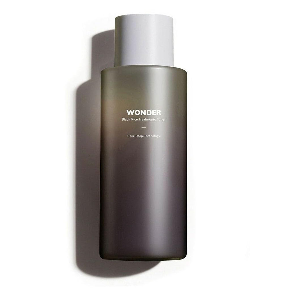 HARUHARU Wonder Black Rice Toner drops on skin showing lightweight hydration in action.