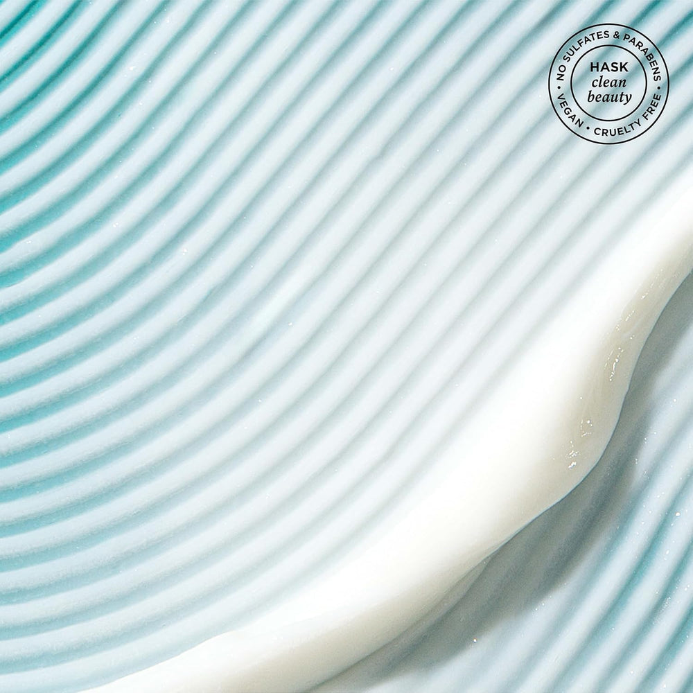 HASK Leave-In Spray applied to hair for detangling ease.