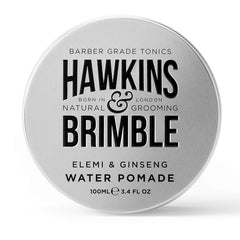 Hawkins & Brimble strong hold pomade bottle closeup demonstrates easy wash and natural shine.