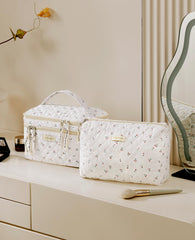 HBselect large bag opened to reveal organized compartments for cosmetics and toiletries.