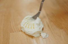Hearth and Homestead balm on bathroom shelf with mild vanilla-orange aroma.