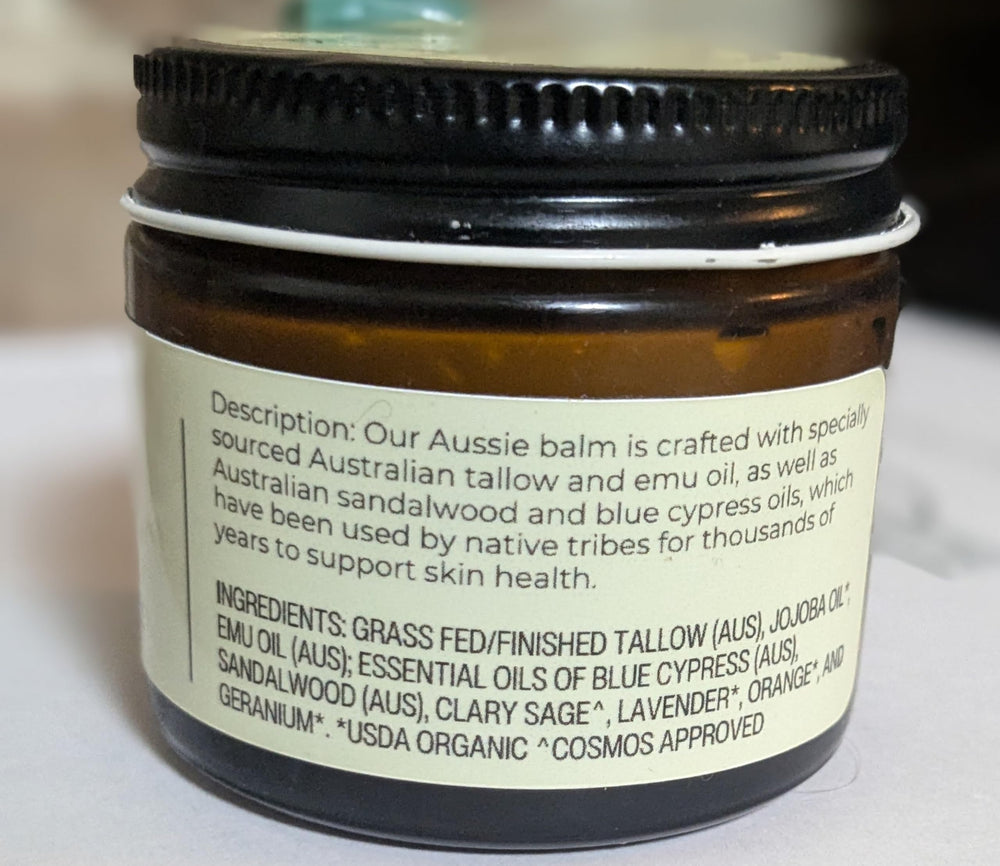 Hearth and Homestead Blue Outback Balm apply-on-hand illustrates quick moisturization during busy days.