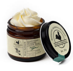 Hearth and Homestead Blue Outback Balm jar closeup shows lush moisture for daily skin care.
