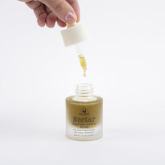 Hearth and Homestead Nectar Serum drops-on-hand demonstrate quick absorption for refreshed, balanced skin.