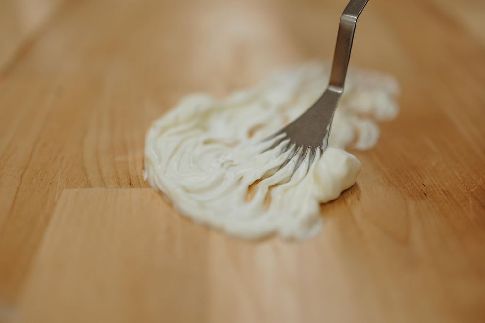 Creamy texture close-up of Hearth and Homestead balm ready for use
