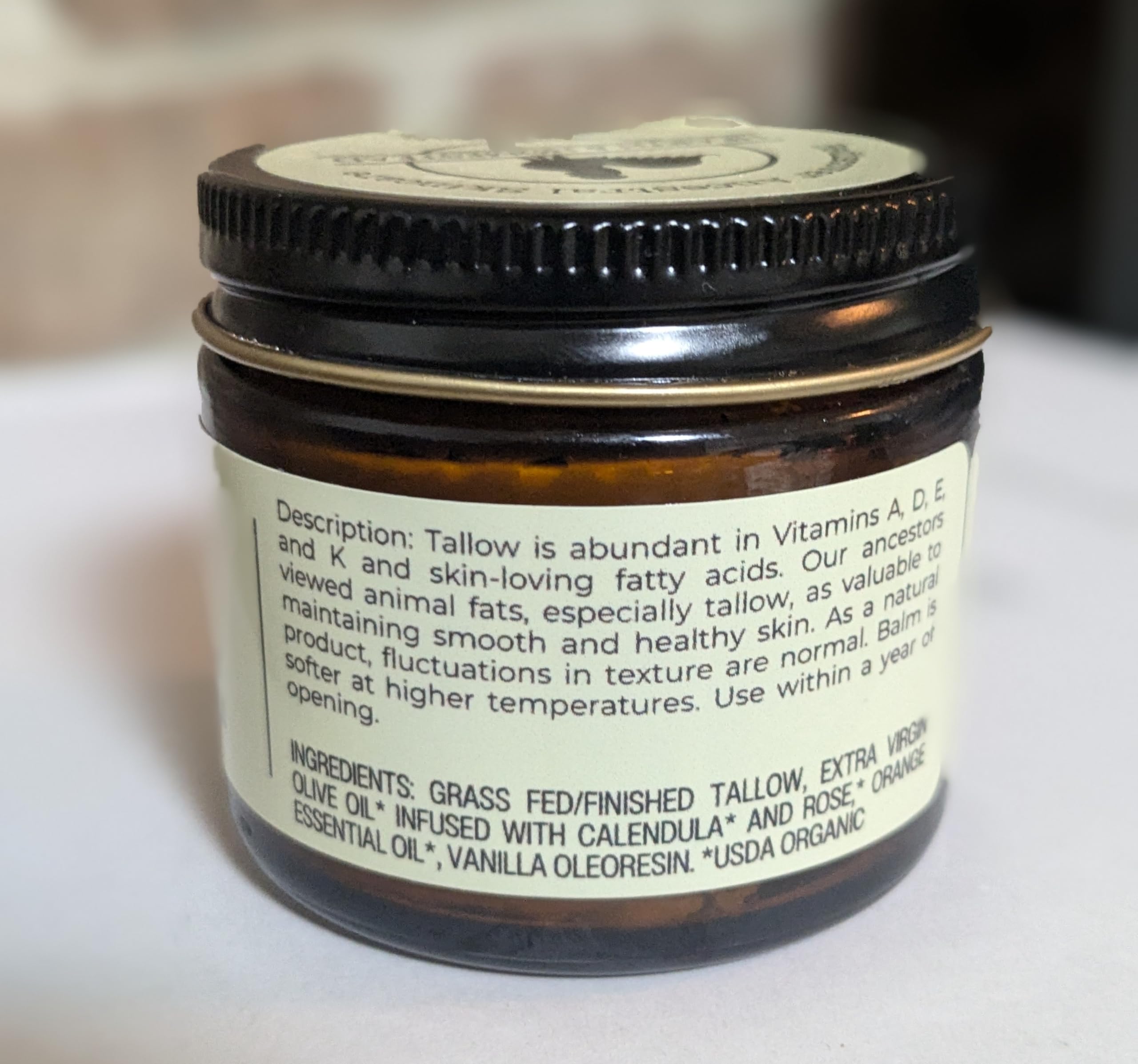 Hearth and Homestead 1-3oz vanilla-orange balm jar ready for on-the-go routine.