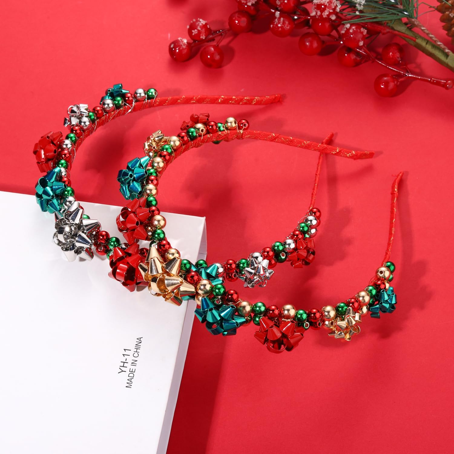 HEIDKRUEGER Christmas headband red green bow beads closeup with gift bow