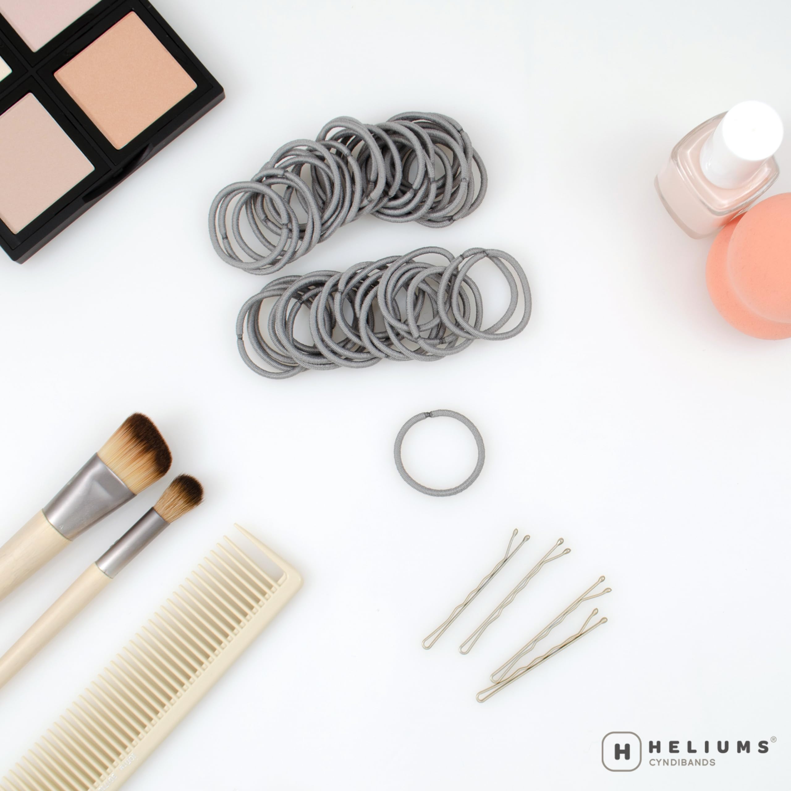 Heliums gray mini-elastics close-up showing fabric-covered, snag-free design.