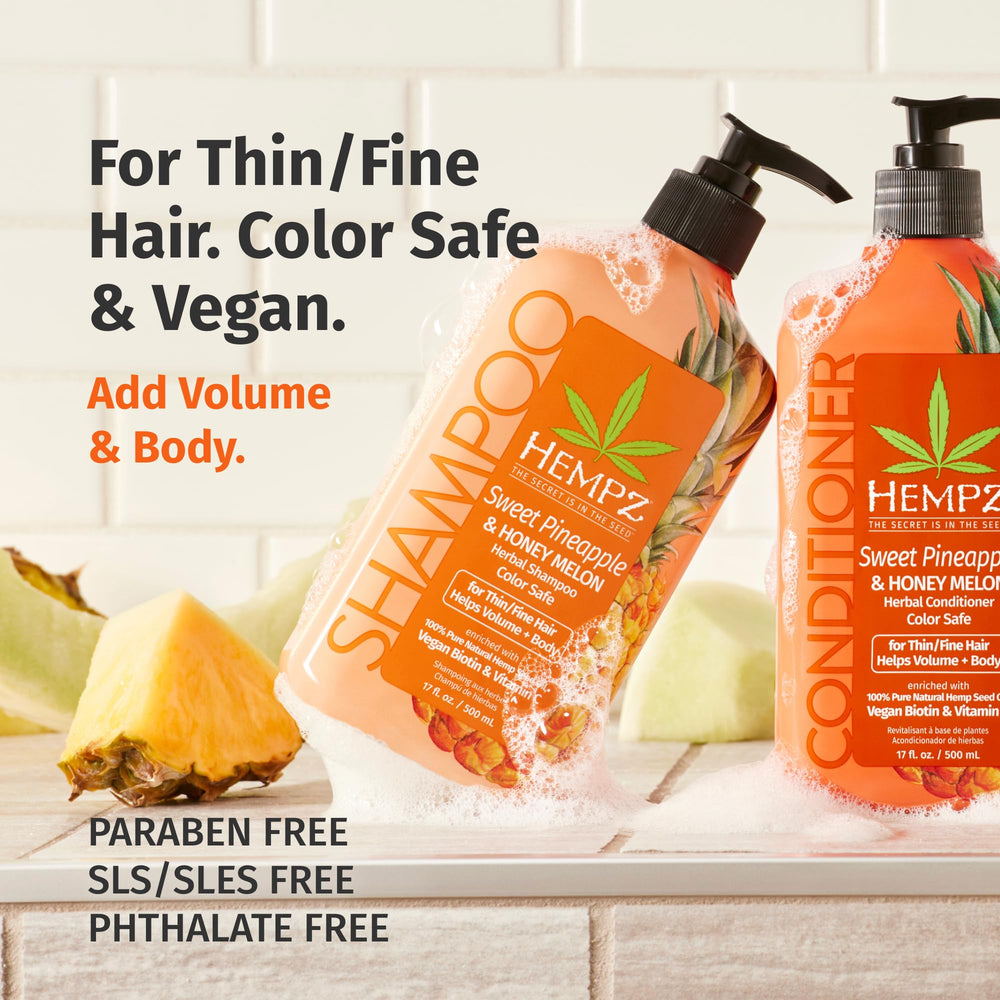 Hempz Biotin Hair Shampoo bottle pouring implying easy application