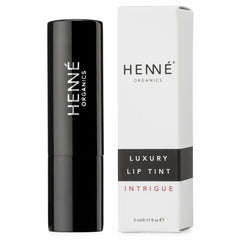 Henné Organics lip tint applying glide shows smooth moisturizing application