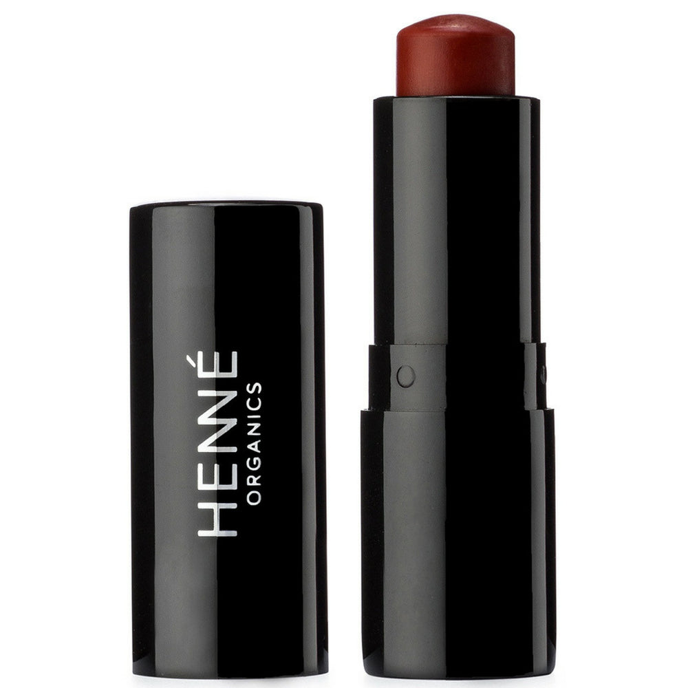 Henné Organics Intrigue brick-red lip tint in sleek tube for natural color