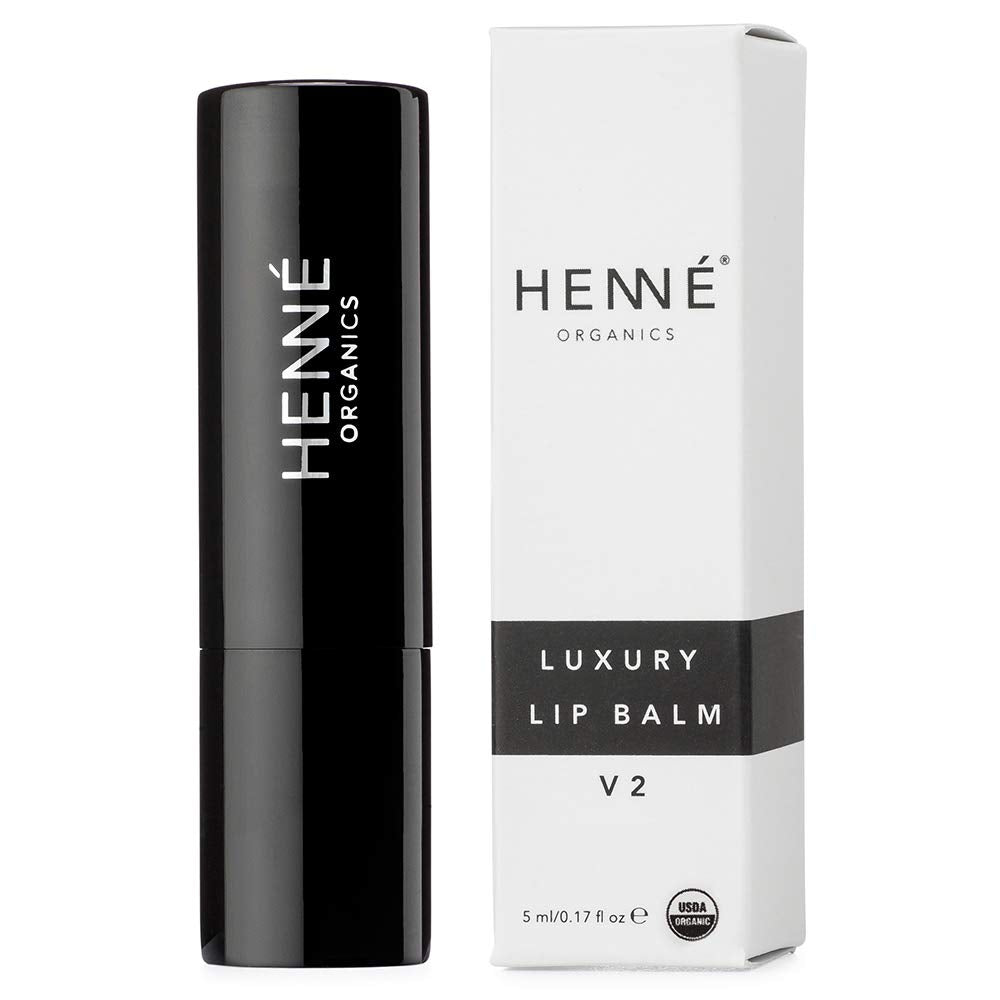 Henné Organics lip balm texture close-up showing creamy glide-on hydration.