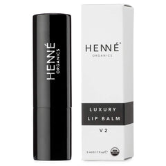 Henné Organics lip balm texture close-up showing creamy glide-on hydration.