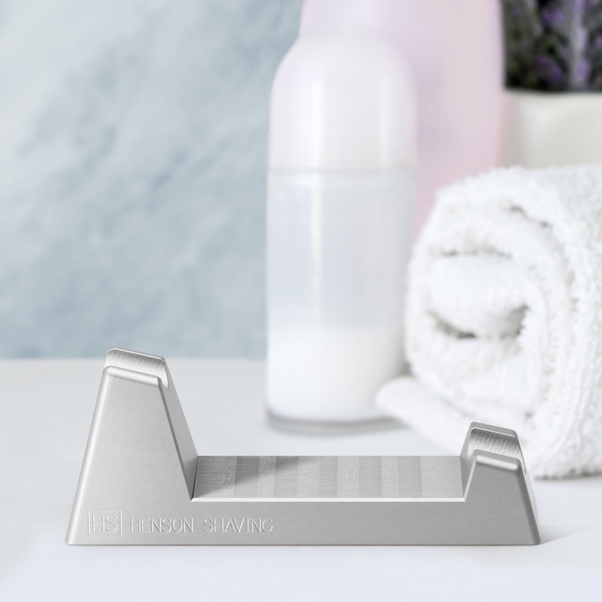 Henson Razor Stand on bathroom counter with razor resting angled for drying