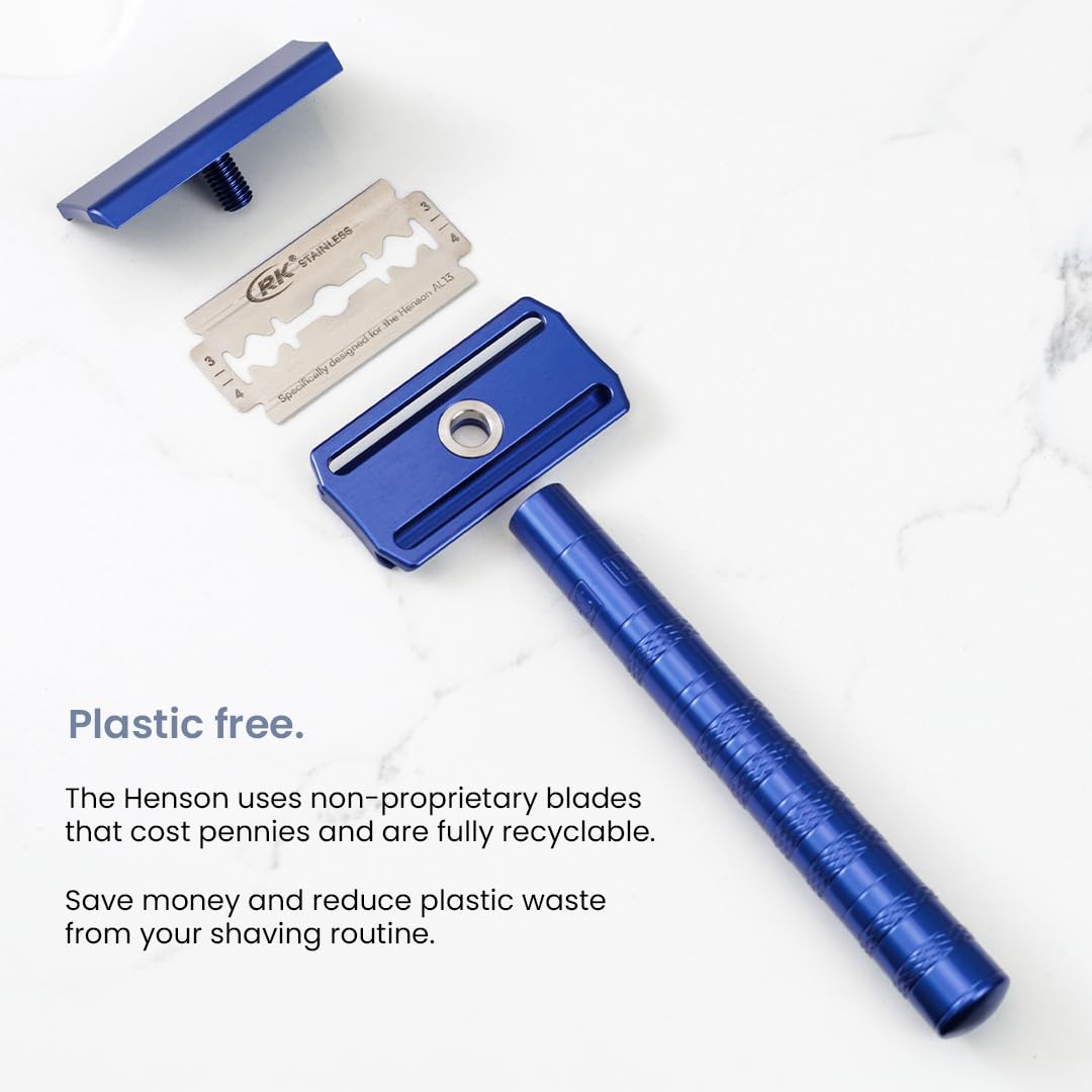 Henson Shaving Razor short free end length near cutting edge improves stability.