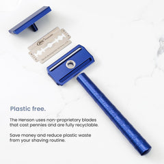 Henson Shaving Razor short free end length near cutting edge improves stability.