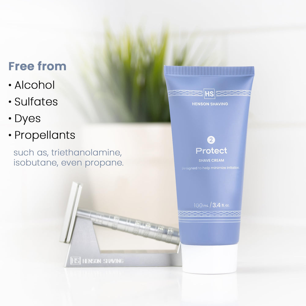 Henson Shaving travel-friendly bottle beside brush and razor ideal for regular grooming routines