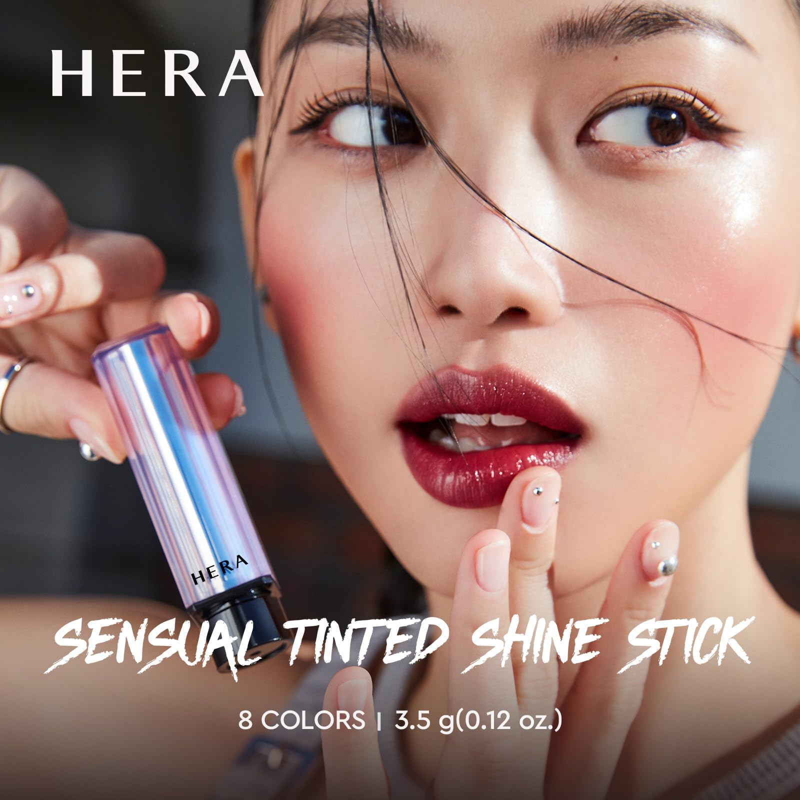 HERA Sensual Tinted Shine Stick application swatch demonstrates sheer to buildable tint for everyday wear