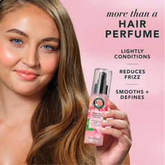 Herbal Essences mist being sprayed into hair for instant freshness