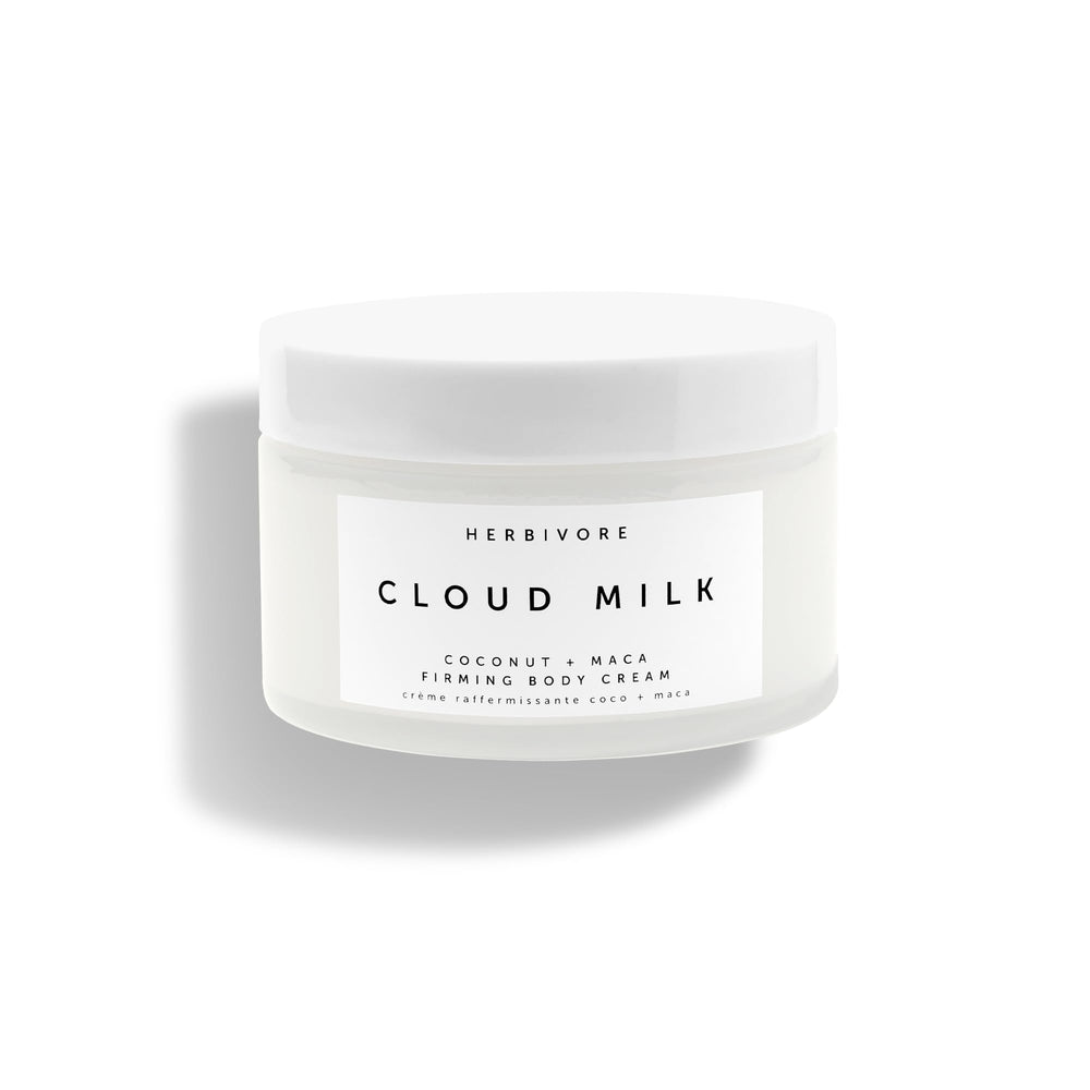 HERBIVORE Cloud Milk bottle close-up showcasing sleek packaging and quick absorption.
