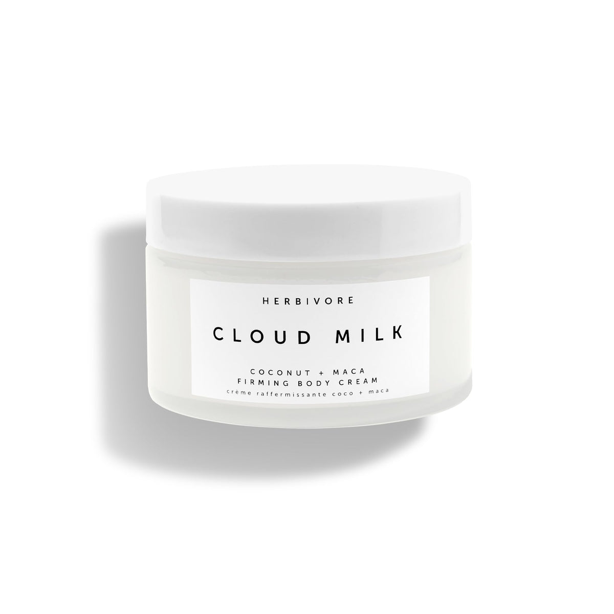 HERBIVORE Cloud Milk bottle close-up showcasing sleek packaging and quick absorption.