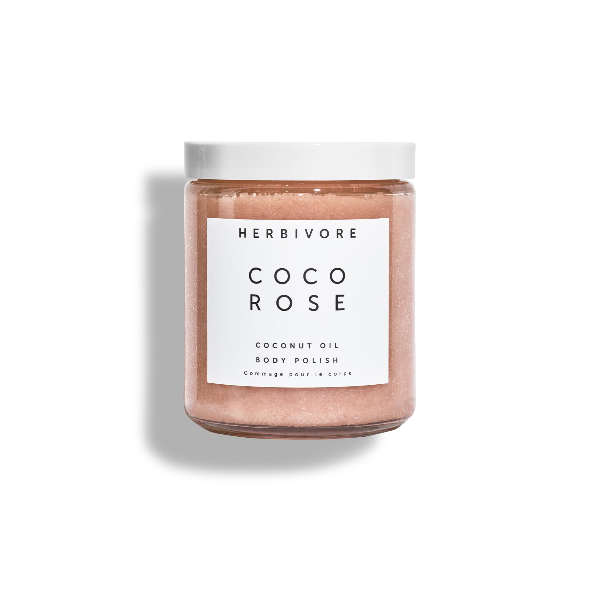 HERBIVORE Coco Rose body polish jar close-up shows creamy exfoliation for smoother skin