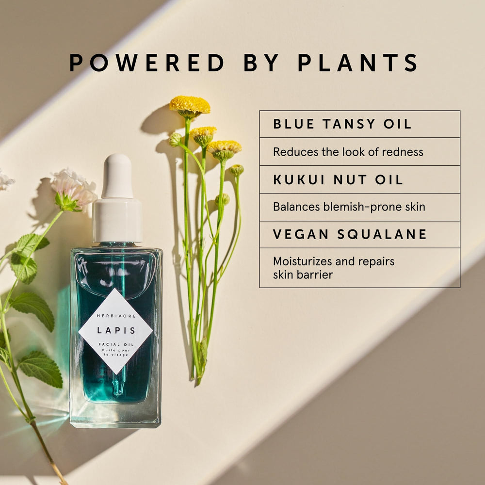 HERBIVORE Lapis Oil blue-tansy flowers image emphasizes calming botanical ingredients for irritated or oily skin.