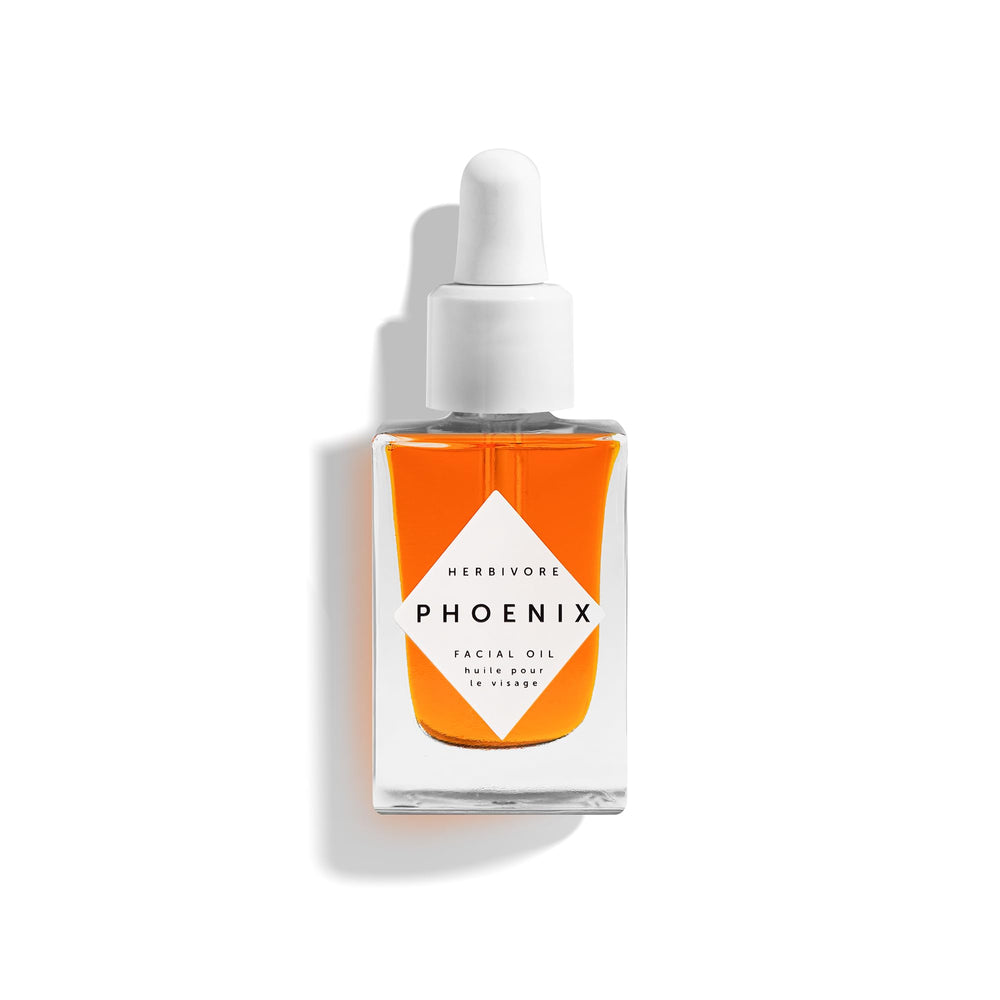 HERBIVORE Phoenix Facial Oil bottle close-up, showcasing luxury packaging and anti-aging skincare appeal.