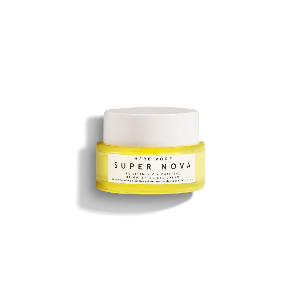 HERBIVORE Super Nova eye cream tube close-up showing brightening formula for under-eye area