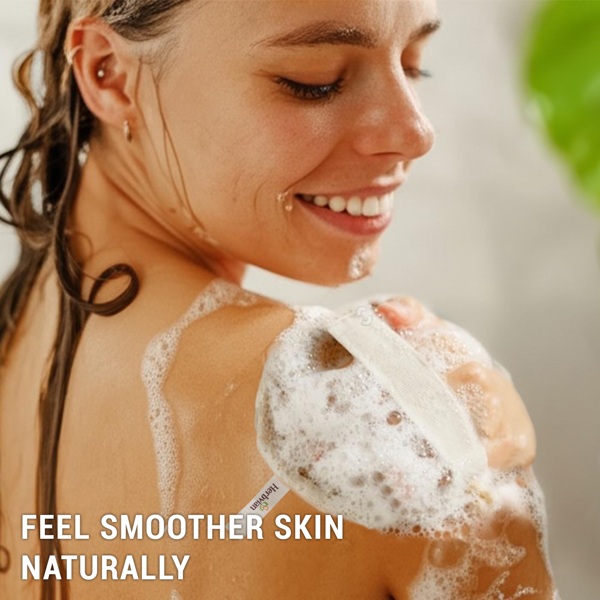 Herbvian loofah pad in-use shower scene for spa-like exfoliation