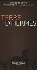 Hermes Terre d'Hermes cap close-up highlighting premium masculine fragrance.