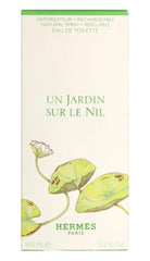 Hermès Un Jardin Sur Le Nil cap close-up suggests travel-friendly fragrance rituals.