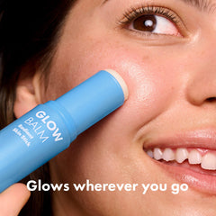 Hero Cosmetics Glow Balm on forehead application for targeted glow.