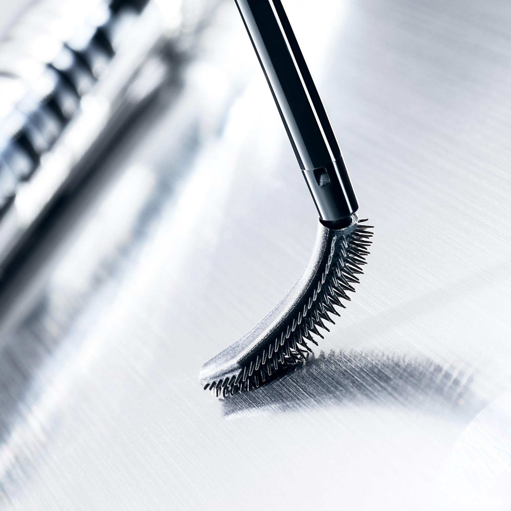 Heroine Make Lash Hype finish-gloss shot highlights glossy black lashes.